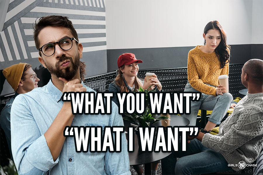 man thinking in front of group of people in cafe