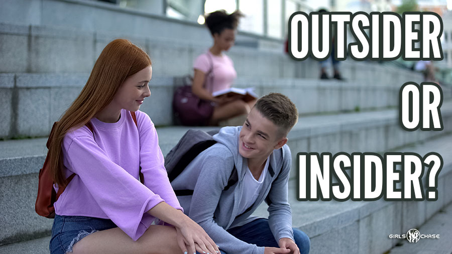male student chatting up female student on steps