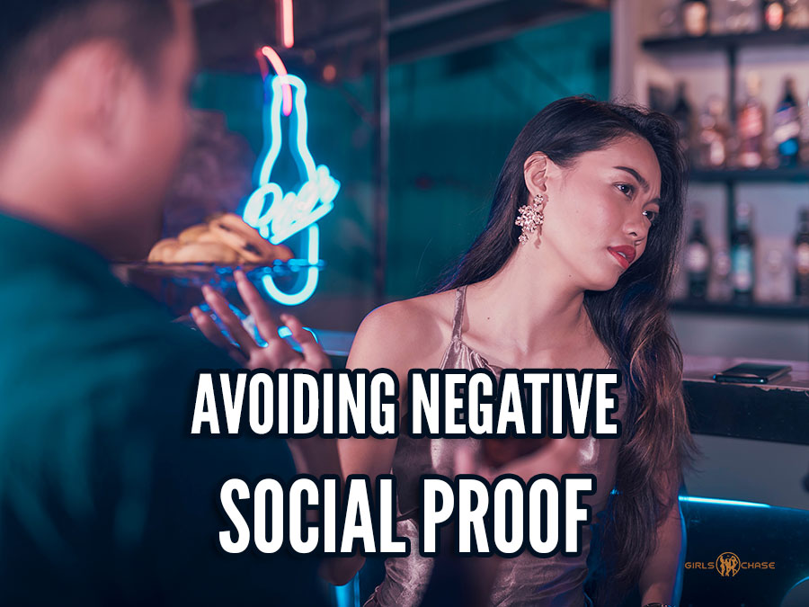 woman rejecting a man at a bar, giving him negative social proof