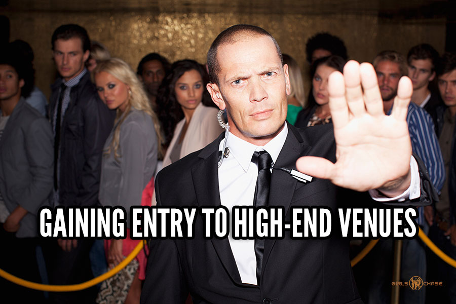 nightclub bouncer with hand up halting entry